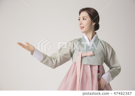 Korean beauty concept photo. Young beautiful woman wearing Hanbok, Korean traditional dress. 221 47482387
