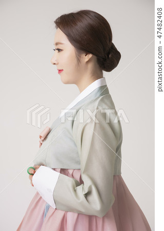 Korean beauty concept photo. Young beautiful woman wearing Hanbok, Korean traditional dress. 199 47482408