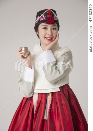 Korean beauty concept photo. Young beautiful woman wearing Hanbok, Korean traditional dress. 065 47482549