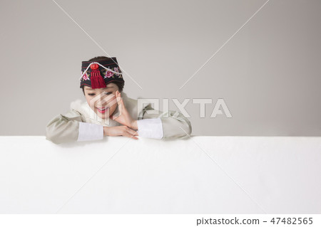 Korean beauty concept photo. Young beautiful woman wearing Hanbok, Korean traditional dress. 059 47482565