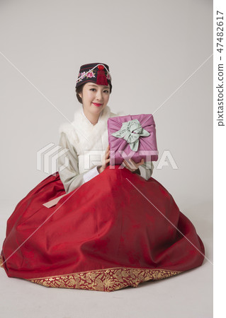 Korean beauty concept photo. Young beautiful woman wearing Hanbok, Korean traditional dress. 054 47482617
