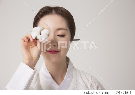 Korean beauty concept photo. Young beautiful woman wearing Hanbok, Korean traditional dress. 019 47482661