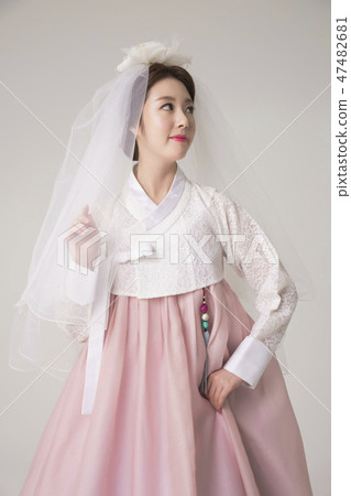 Korean beauty concept photo. Young beautiful woman wearing Hanbok, Korean traditional dress. 001 47482681