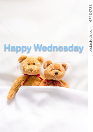 Teddy Bear lying in bed message Happy Wednesday 47484728