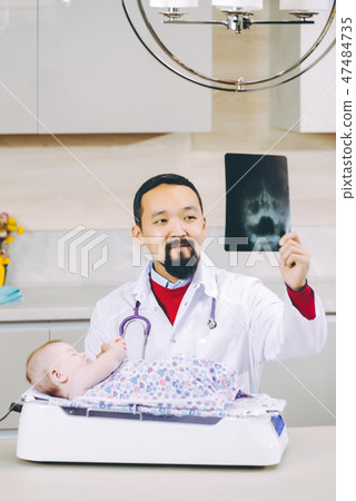 doctor examining x-ray picture doctor examining x-ray picture 47484735