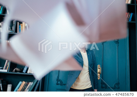 successful bald bearded man throwing documents  47485670