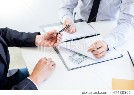 Businessman receive money in the envelope offered in file taking 47488505