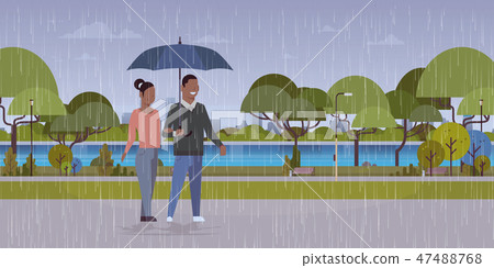 lovers couple under umbrella african american man woman romantic walking in rain city urban park lovers couple under umbrella african american man woman romantic walking in rain city urban park 47488768