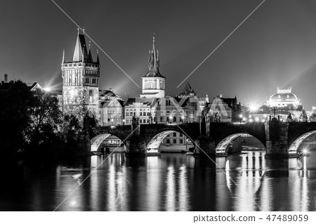 Vltava River and Charles Bridge with Old Town Bridge Tower by night, Prague, Czechia. UNESCO World Vltava River and Charles Bridge with Old Town Bridge Tower by night, Prague, Czechia. UNESCO World 47489059