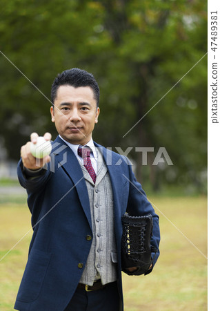 Businessman holding baseball ball 47489381