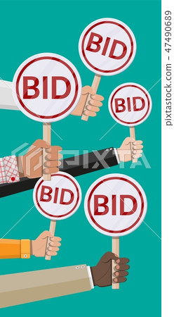 Hands holding auction paddle. Hands holding auction paddle. 47490689