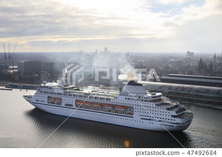 Large cruise ship in the harbor of Amsterdam 47492684
