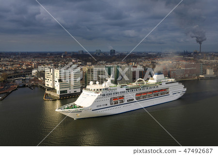Large cruise ship in the harbor of Amsterdam Large cruise ship in the harbor of Amsterdam 47492687