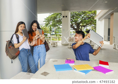 Group of young asian studying in university playing students col Group of young asian studying in university playing students col 47493182