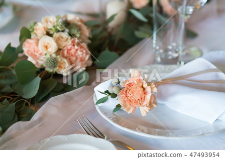 table decorated with fresh flowers and candles for a wedding dinner 47493954