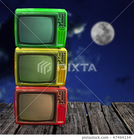 Retro television overlap on wooden deck with moon Retro television overlap on wooden deck with moon 47494134