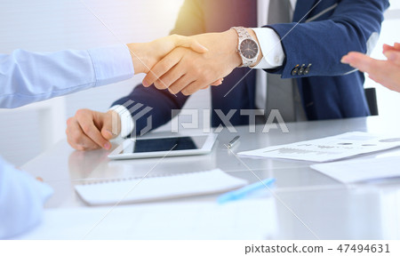 Group of business people or lawyers shaking hands finishing up a meeting , close-up. Success at Group of business people or lawyers shaking hands finishing up a meeting , close-up. Success at 47494631