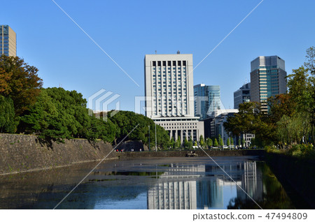 A photograph of the arch of Triumph of the Imperial Palace (formerly Edo Castle) in Chiyoda Ward, Tokyo and the building of the white DN Tower 21 A photograph of the arch of Triumph of the Imperial Palace (formerly Edo Castle) in Chiyoda Ward, Tokyo and the building of the white DN Tower 21 47494809