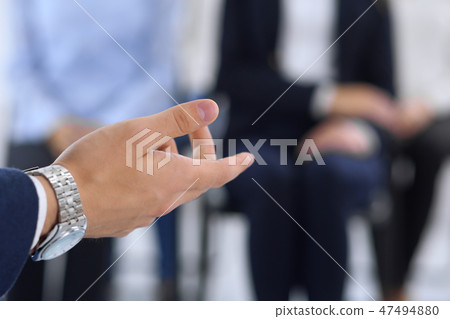 Business man making presentation to group of people. Speaker delivering a seminar to his colleagues 47494880