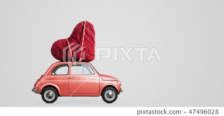Toy car delivering heart Toy car delivering heart 47496028