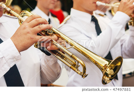 trumpeter playing at a jazz festival in a park trumpeter playing at a jazz festival in a park 47497881