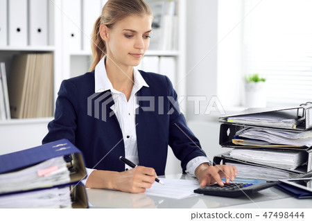 Modern business woman or confident female accountant in office. Student girl during exam preparing 47498444
