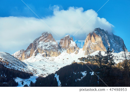 The Sassolungo Group massif covered in snow The Sassolungo Group massif covered in snow 47498953