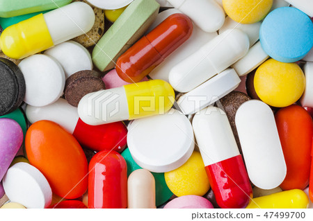 Heap of pills - medical background 47499700