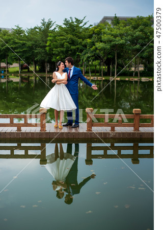 Romantic couple dancing by the lake Romantic couple dancing by the lake 47500379