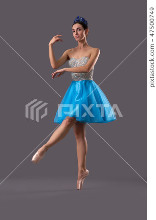 View from side of ballerina dancing on isolated background View from side of ballerina dancing on isolated background 47500749