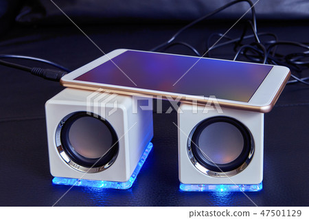 Speakers are connected with cable to smartphone. Speakers are connected with cable to smartphone. 47501129
