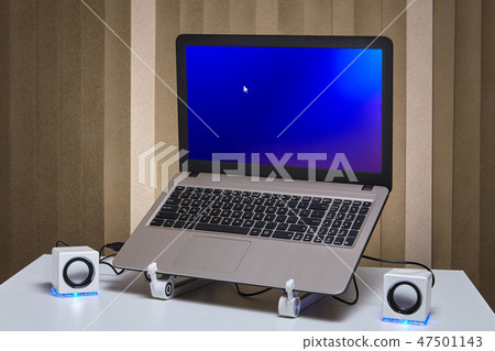 Starting laptop with two speakers on the sides. Starting laptop with two speakers on the sides. 47501143