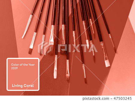 Living Coral color of the Year 2019. Paint brushes with coral in trendy color Living Coral color of the Year 2019. Paint brushes with coral in trendy color 47503245