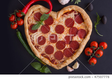 Pizza heart shaped with pepperoni Pizza heart shaped with pepperoni 47507778