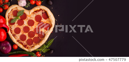 Pizza heart shaped with pepperoni Pizza heart shaped with pepperoni 47507779