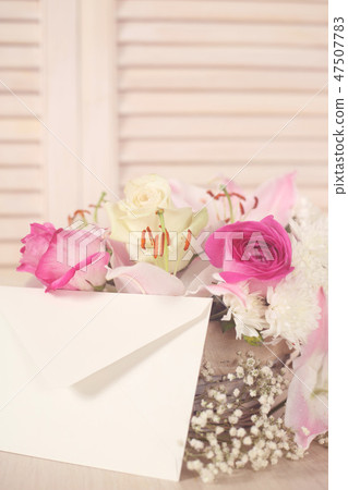 Basket of flowers and envelope 47507783