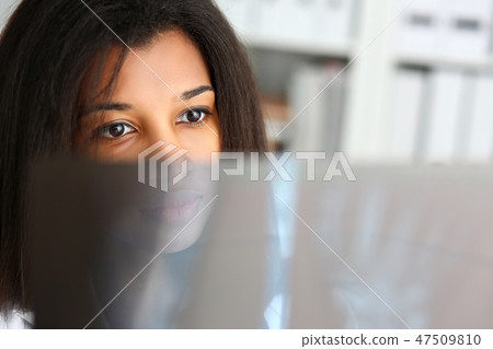 Female black doctor hold in arm and look Female black doctor hold in arm and look 47509810