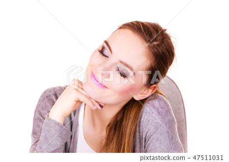 Woman sitting at desk in office and dreaming Woman sitting at desk in office and dreaming 47511031