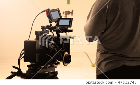 Behind video camera recording online commercial Behind video camera recording online commercial 47512745