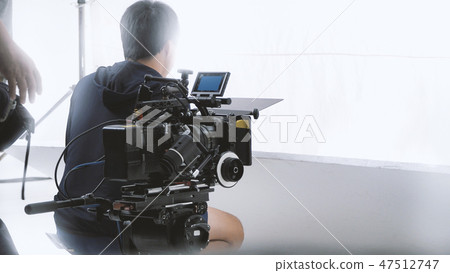 Behind video camera recording online commercial 47512747