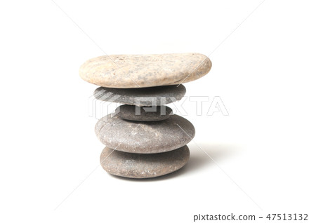 closeup of stone balance on white background closeup of stone balance on white background 47513132