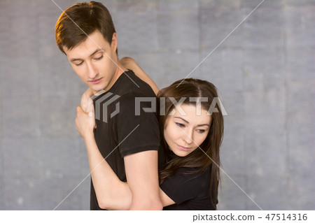 Young pretty dancer hugging her partner. 47514316