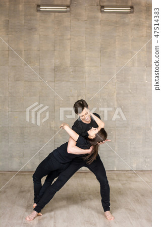 Young couple performing romantic dance. 47514383