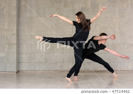 Couple in black suits dancing. 47514402