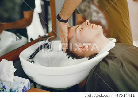 Man in barbershop. 47514411