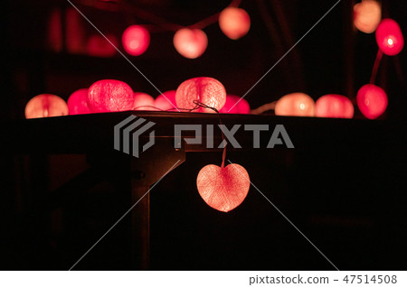 Closeup heart shape of led lights in dark room Closeup heart shape of led lights in dark room 47514508