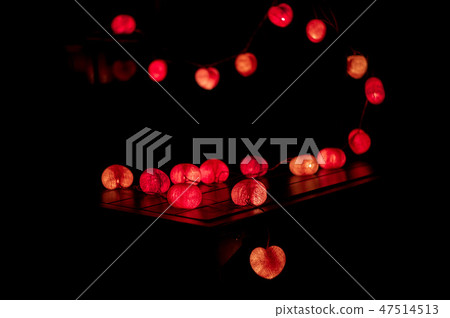 Closeup heart shape of led lights in dark room Closeup heart shape of led lights in dark room 47514513