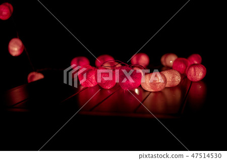 Closeup heart shape of led lights in dark room Closeup heart shape of led lights in dark room 47514530