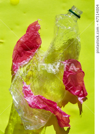 a Plastic bottle pollution on yellow background 47514804