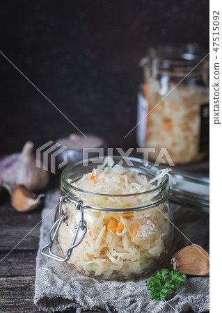 Glass jar with homemade sauerkraut Glass jar with homemade sauerkraut 47515092